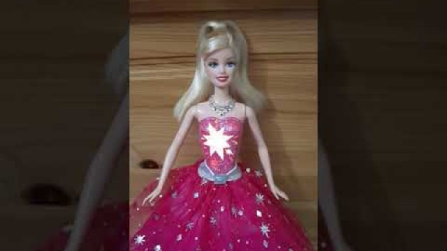 'barbie and a fashion fairytale singing doll.'