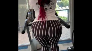 'Big ass sexy girl in gym , sexy look , big bubble butts , red heir very hot look'