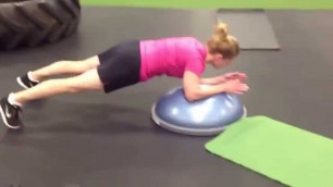 'DUDAS FITNESS Client: Kristine demonstrates Bosu Shifting Planks'