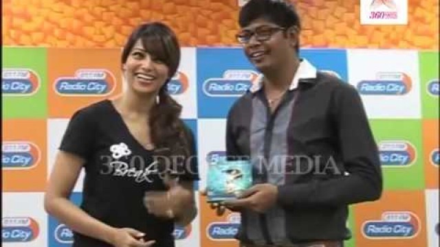 'Bipasha Basu gives copies of her fitness DVD \'Break Free\' to some audience members'