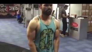'Afzal Pasha, a member of 360 Fitness working on his shoulders'