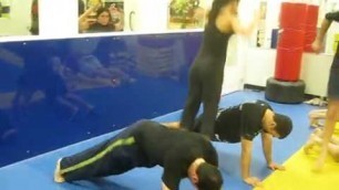 'Combat Fitness exercise jumping over flipping push up partners'