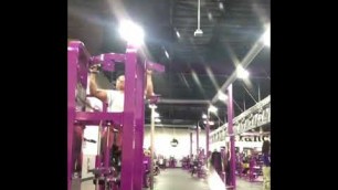 'EZ bar bicep curls with the Natty Lunk at Planet Fitness'